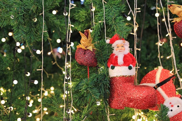 Christmas decorative items on white background. Red boot with little Santa.