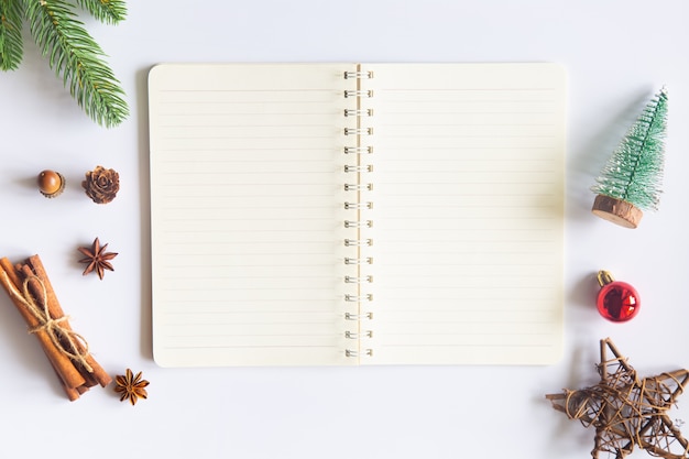 christmas desk with open notepad and ornaments