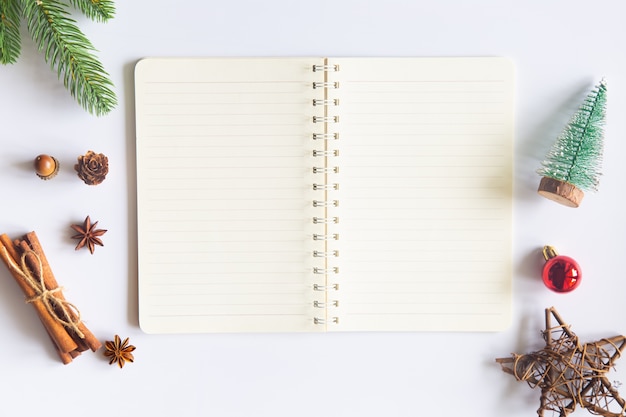 Christmas desk with open notepad and ornaments