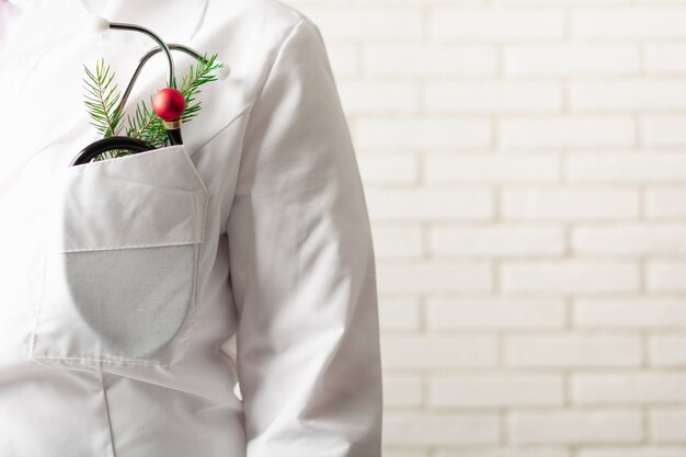 Christmas doctor and stethoscope with new years ball instead of instrument part