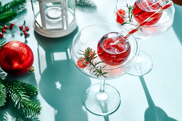 Christmas drink mimosa punch or margarita cocktail serving in christmas ornaments