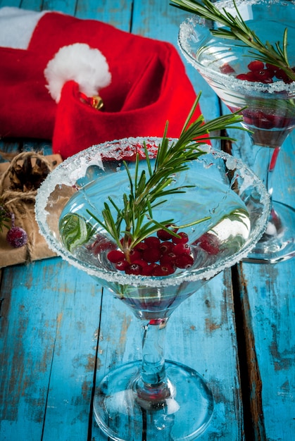 Christmas drink with cranberries and rosemary