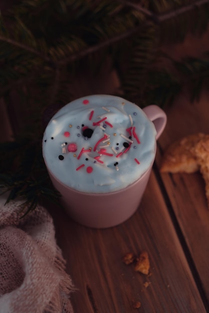 Christmas drink with homemade cookies on a wooden table