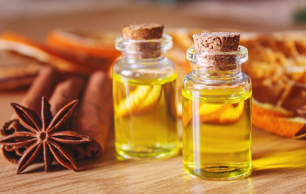 Christmas essential oils in a small bottle. Selective focus.