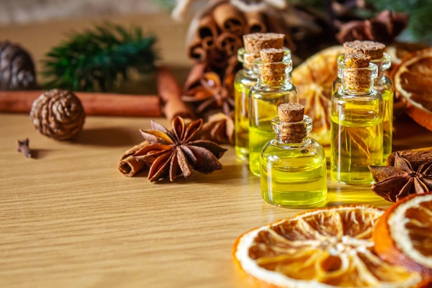 Christmas essential oils in a small bottle. Selective focus.