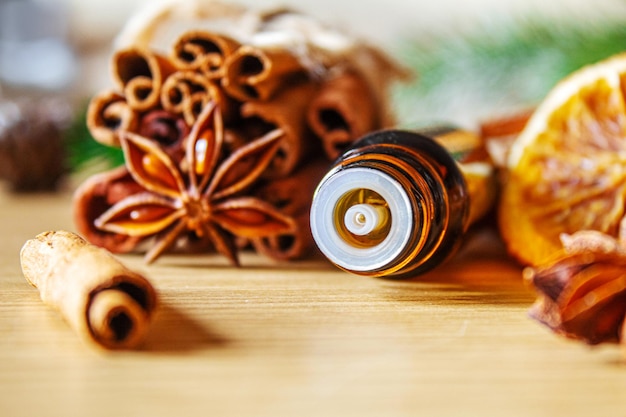 Christmas essential oils in a small bottle. Selective focus.