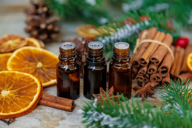 Christmas essential oils in small bottles. Selective focus.