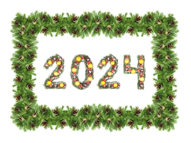 写真 クリスマス・イブの背景と2024の数字 クリスマス・ツリーの枝が白い背景に隔離された