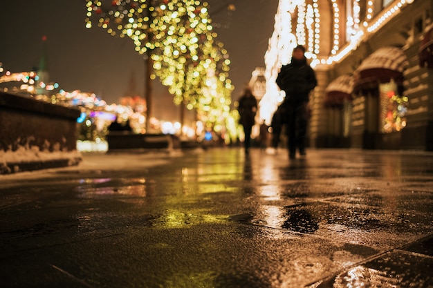 Christmas fair in Moscow evening while snow