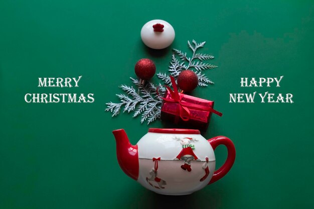 Christmas. FAMILY HOLIDAY . KETTLE, GIFTS .GREEN BACKGROUND