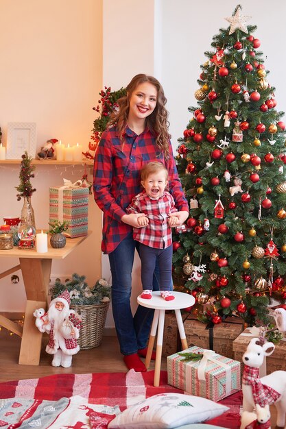 Christmas family Mom and son. Merry Christmas and Happy Holidays Portrait.