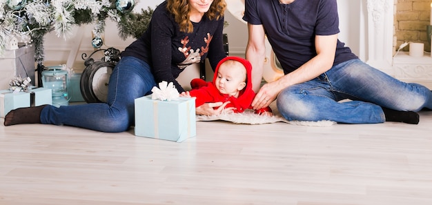 Christmas Family Portrait In Home Holiday Living Room, Kids and dog play, Present Gift Box, House Decorating By Xmas Tree Candles Garland