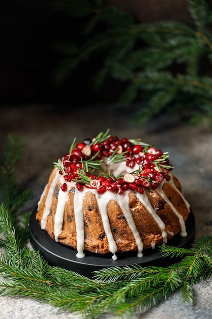 Christmas festive cake with cranberry and Christmas decorations.