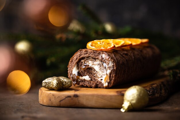 Christmas festive chocolate roll cake with cream