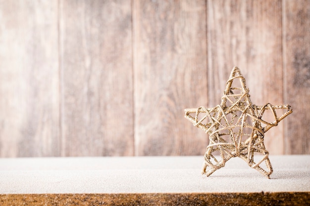 Christmas fir branch and decor, on the wooden background.