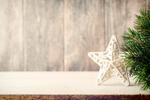 Christmas fir branch and decor, on wooden