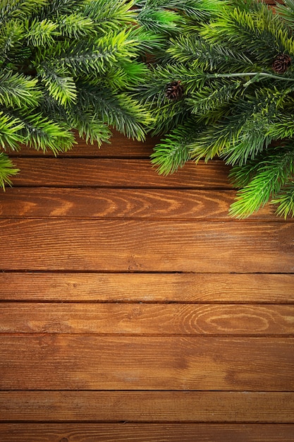 Christmas fir tree branches on wooden table