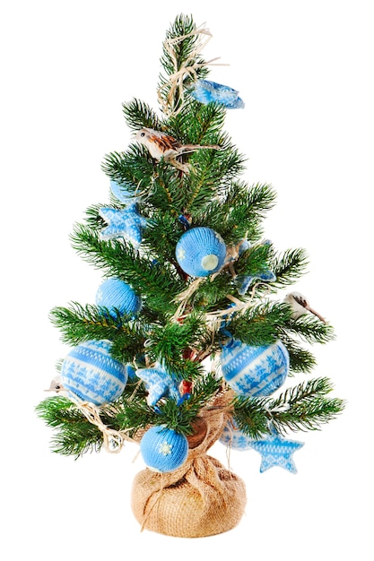 Christmas fir tree decorated with toys and Christmas decorations isolated on white