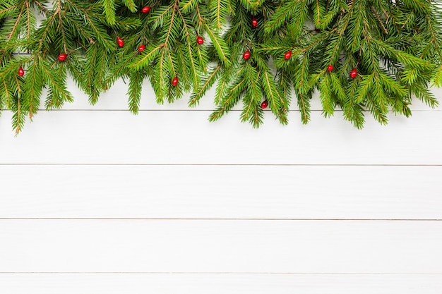 Christmas fir tree on white wooden board