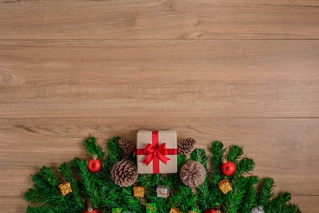 Christmas fir tree with decoration on wooden board