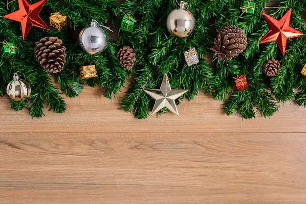 Christmas fir tree with decoration on wooden board