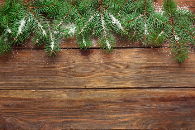 Christmas fir tree on wooden background