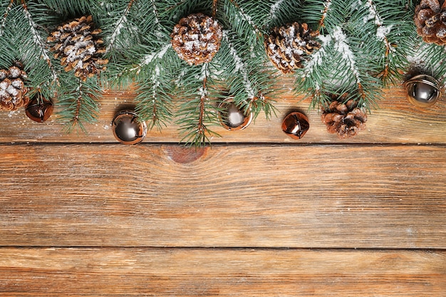 Christmas fir tree on wooden background