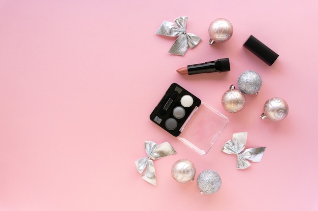 Christmas flat lay of make up products and decorations