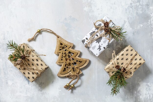 Christmas flat lay with Christmas decorations and presents on a grey stone background