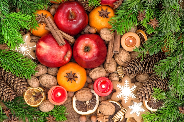 Christmas food backdround. Fruits, cookies, spices and nuts. Top view