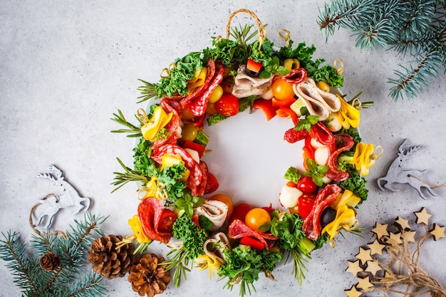 Christmas food background. Christmas wreath of holiday snacks