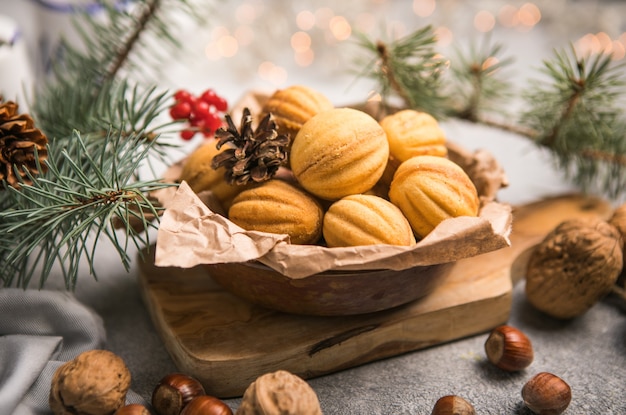 Christmas food. Shortbread walnut shaped cookies oreshki with caramel.