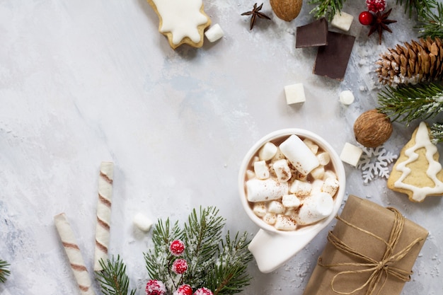 Christmas frame A cup of hot chocolate and gingerbread Christmas gifts on the table Flat lay