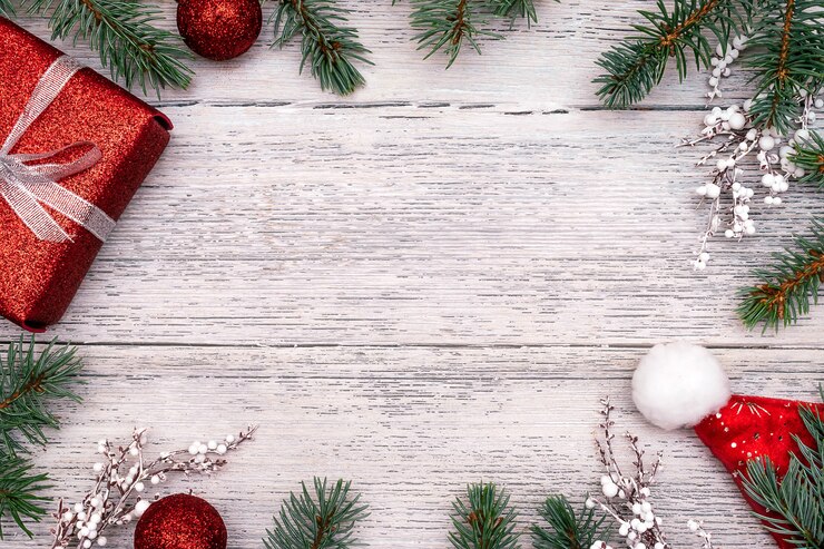 モミの木のbranchstwigsgiftボックスボールとサンタクロースの帽子で作られたクリスマスフレーム