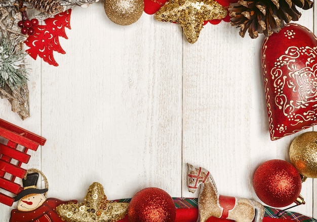 Christmas frame on white wooden surface