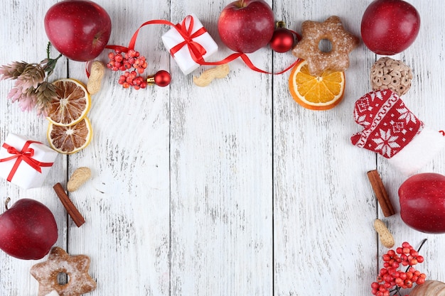 Christmas frame with apples, cookies and decorations