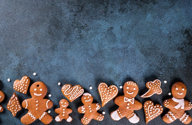 Christmas frame with gingerbread cookies Christmas cookies nuts and spices Copy space for text Winter holidays background mock up New year composition