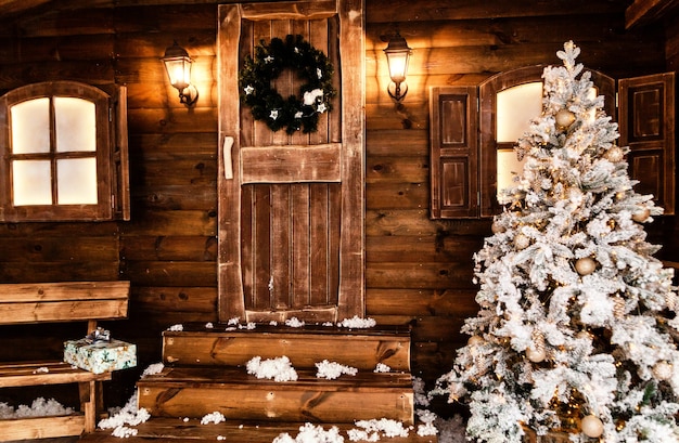 Christmas front door of a country house background. Concept Happy Christmas, New Year, holiday, winter, greetings. Photo