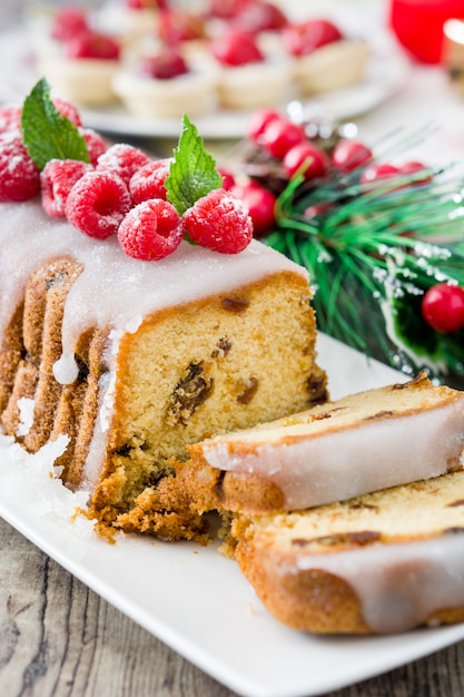 Christmas fruit cake on a rustic wooden table