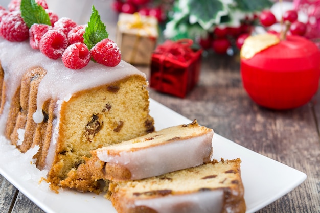 Christmas fruit cake on a rustic wooden table