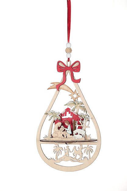 Christmas gadget to hang on the Christmas tree with figures of Santa Claus, nativity scene, sleigh