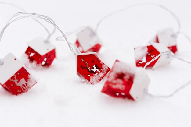 Christmas garland red snow. christmas colorful horizontal\
postcard. the concept of a festive mood.