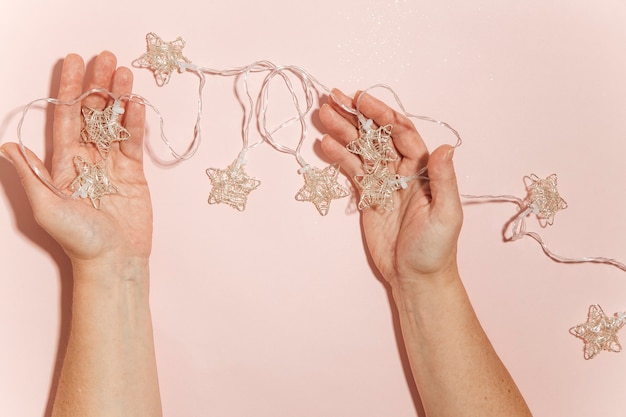 christmas garlands on a pink background