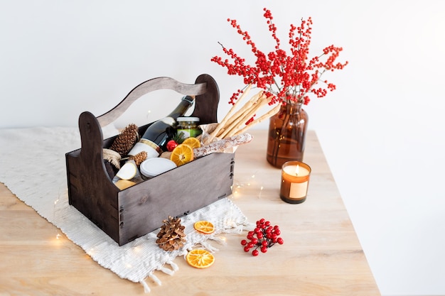 Christmas gift basket with food and decorations