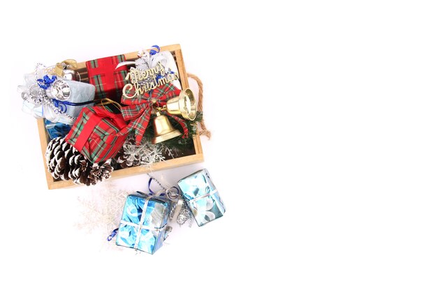 Christmas gift in a basket with white backdrop.