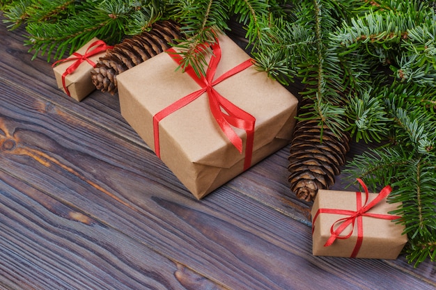 Christmas gift box, Christmas presents in red boxes at black wooden table. 