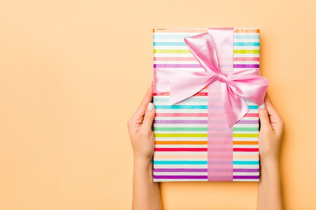 Christmas gift box on colorful background