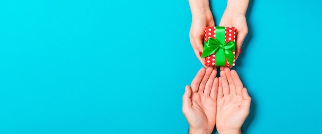 Christmas gift box on colorful background