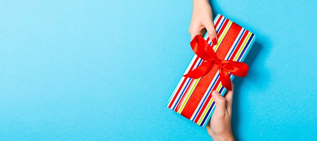 Christmas gift box on colorful background