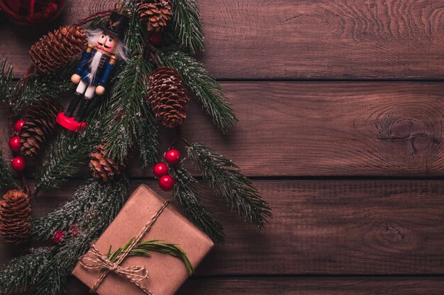 Christmas gift box decorated in kraft paper with tree branches